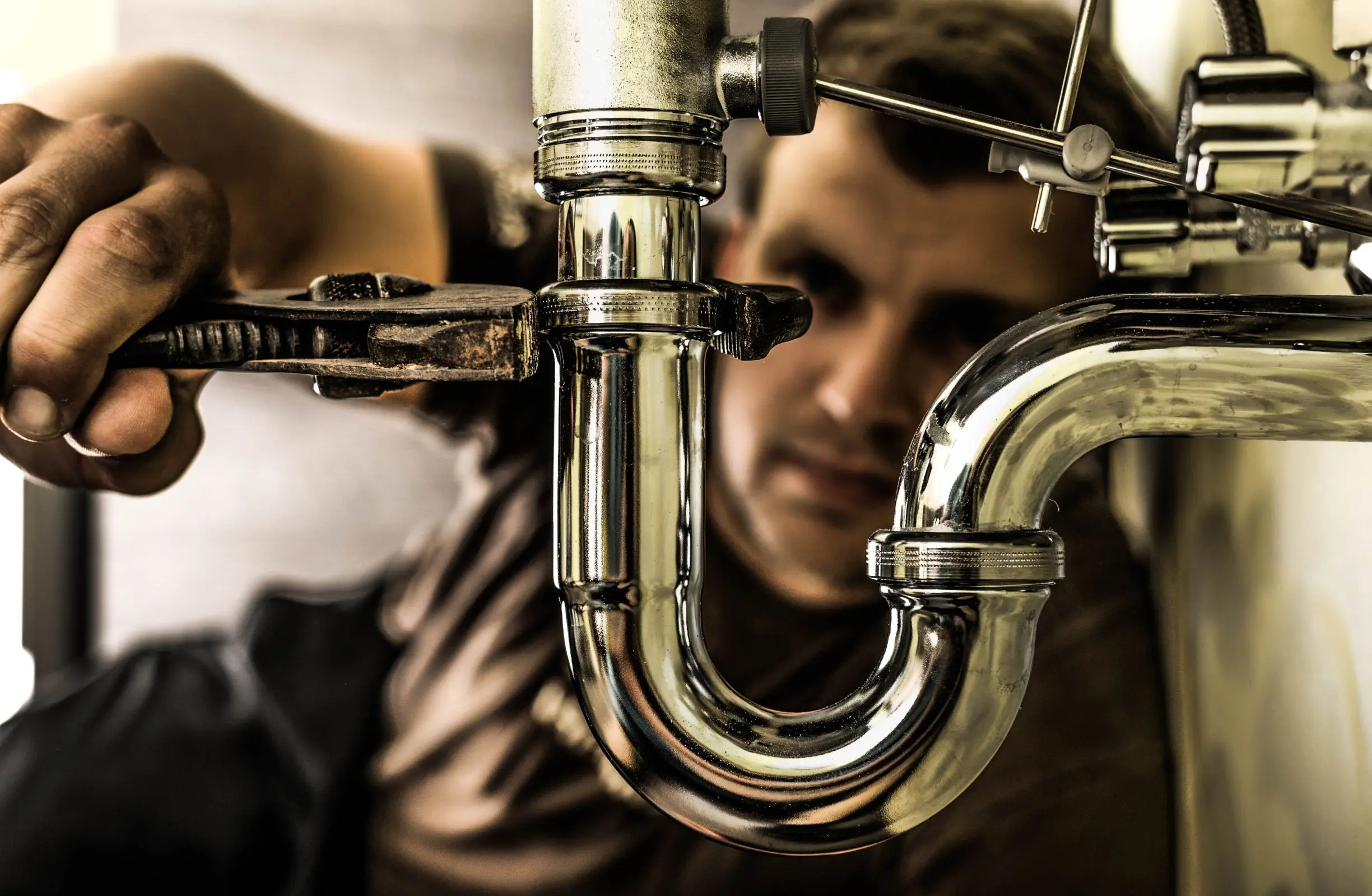 Man fixing the plumbing pipes